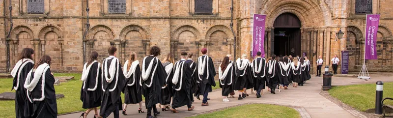 Graduands in robes entering Durham Cathedral