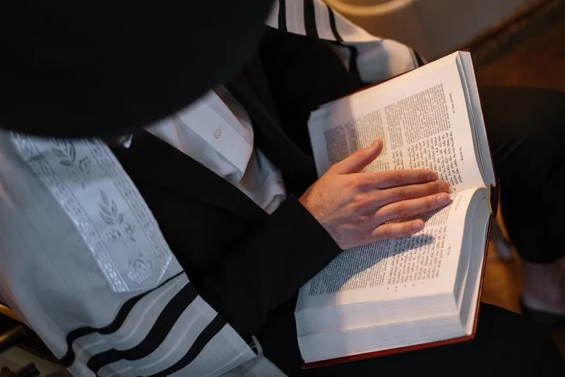 Person reading Torah