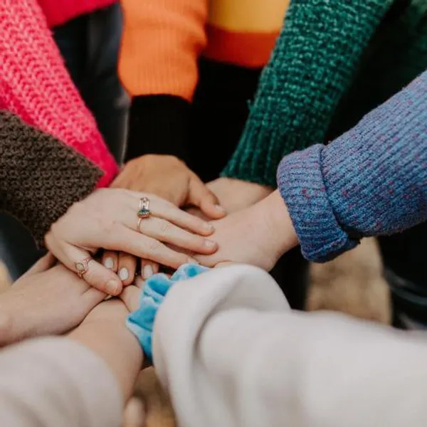 Group of hands in circle