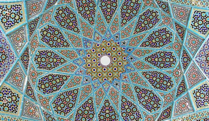 The ornate tiled ceiling of the Tomb of Hafez pavilion