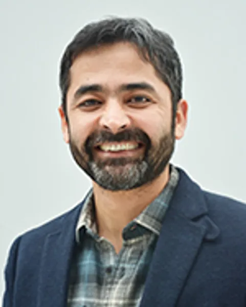 Portrait style image of Dr Mujeeb U. Chaudhry, PhD smiling