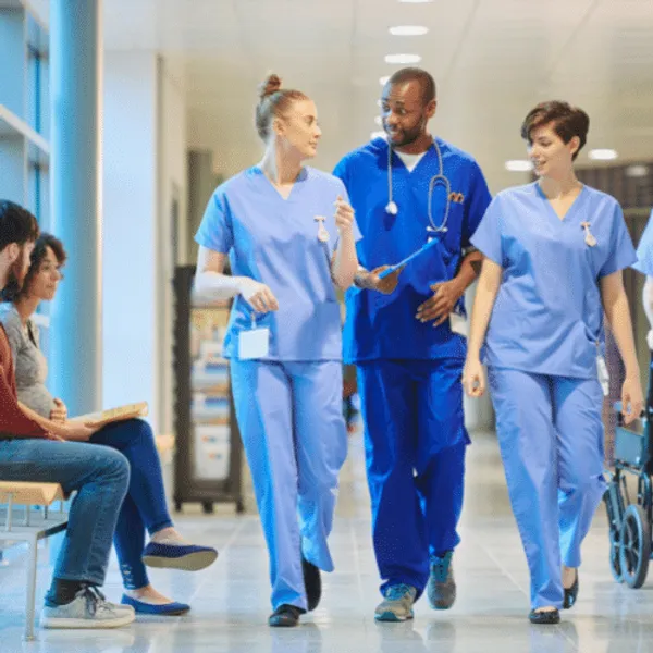 A hospital team walking down a corridor