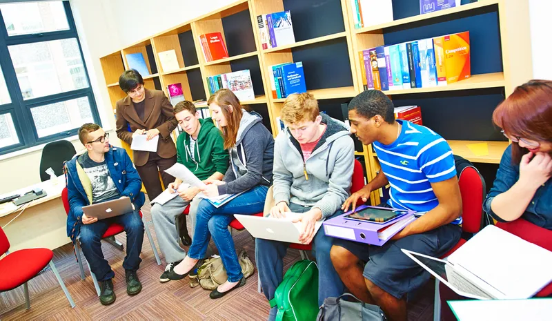 A busy tutorial with students sitting in a semi-circle