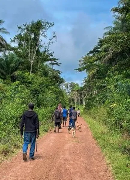 Men walking down a dusty track in Sierra Leone