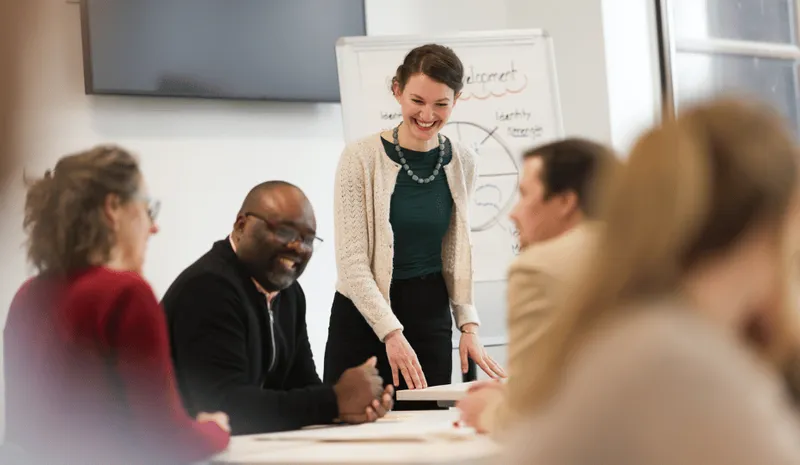 A group of researchers talking around a table