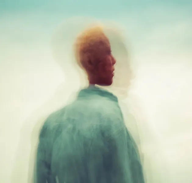 Abstract photograph of a human figure with blur visual effects duplicating the figure.