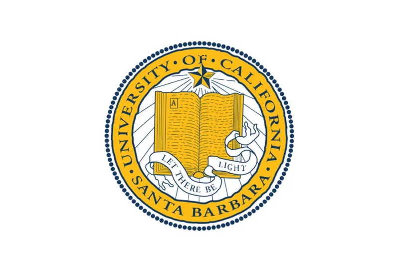 Yellow logo of UC St Barbara with a book in the centre
