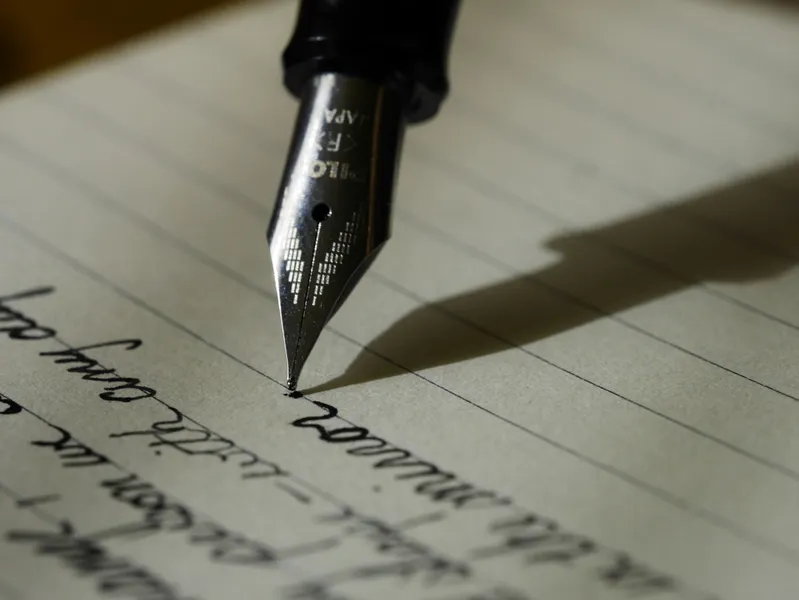 Pen on paper and writing