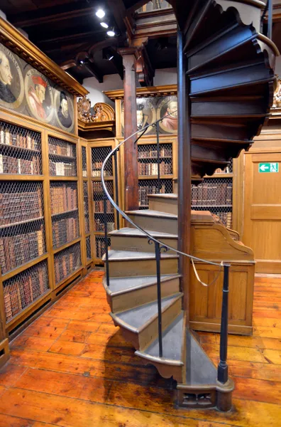 A library with a large staircase in the middle
