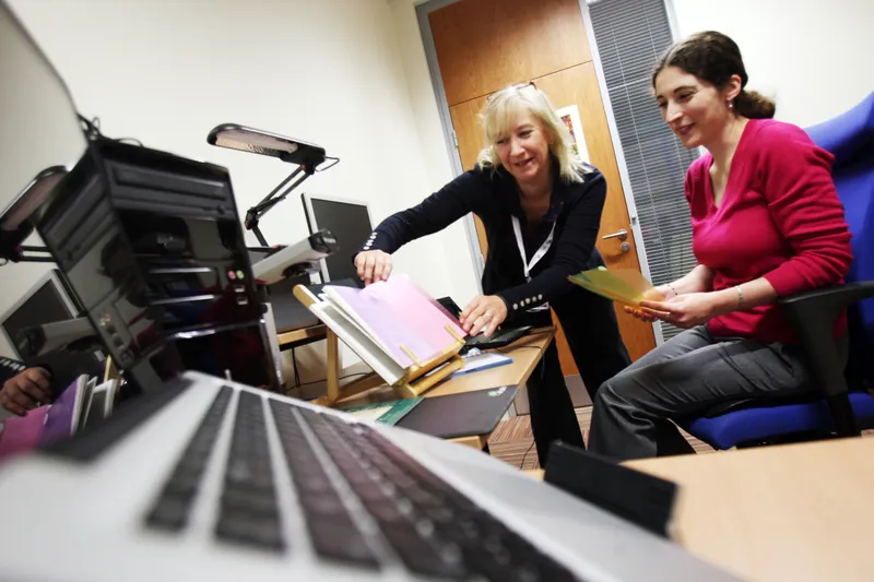Staff member assisting a student