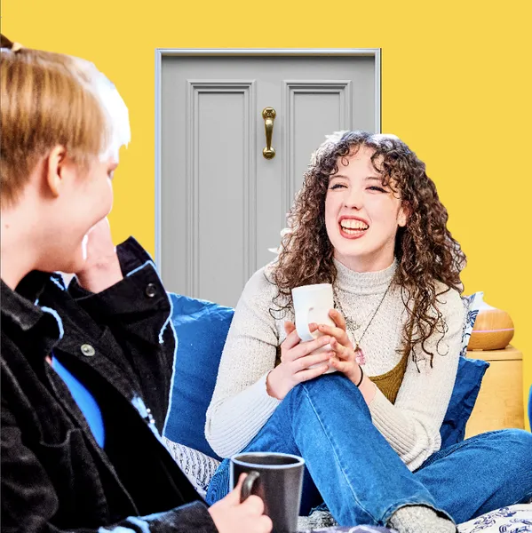 Two students chatting in front of a house door on a yellow background
