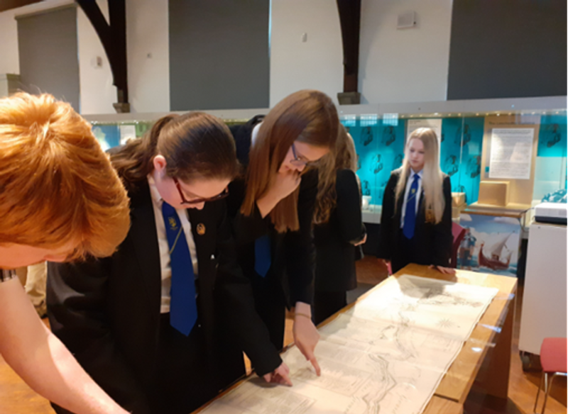 Group of Students Looking at Archive Material