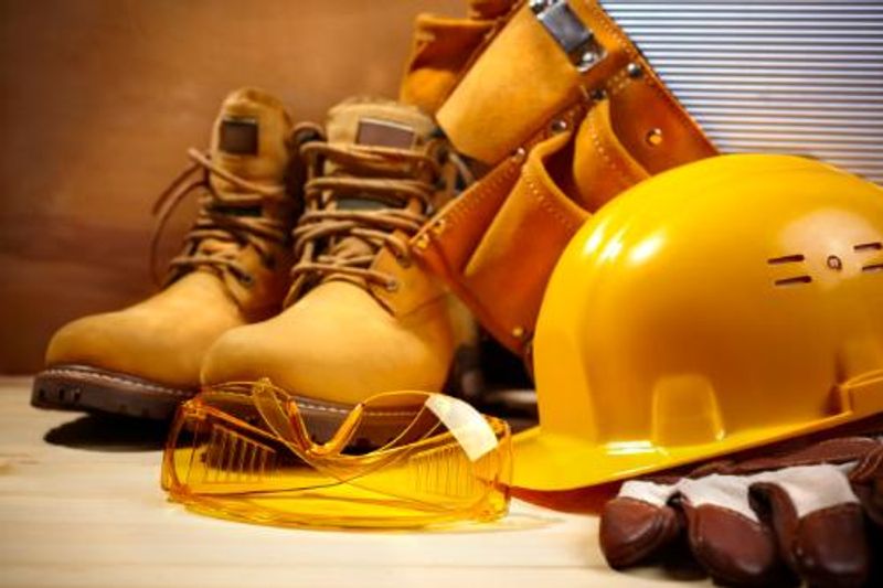 Construction safetywear including a hard hat, visor and workboots