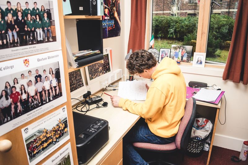 Student working at a desk in College accommodation
