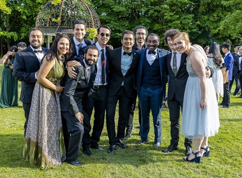 Postgraduate students outside in evening wear at Beamish formal