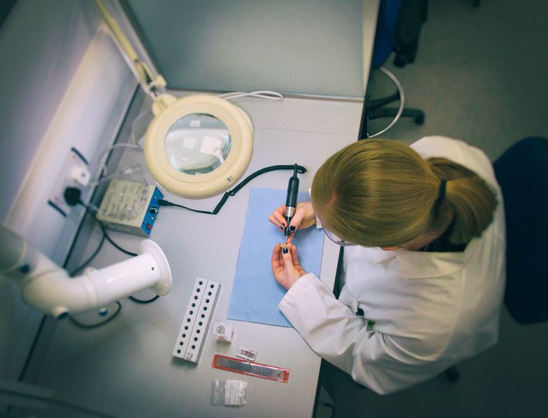 A student extracting a small piece of tooth for isotope analysis