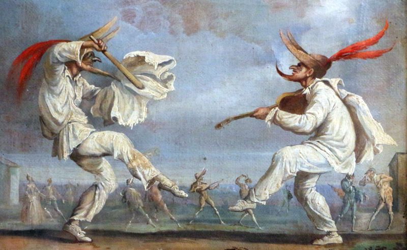 Two theatrical men in white clothing, wearing exaggerated masks and dancing