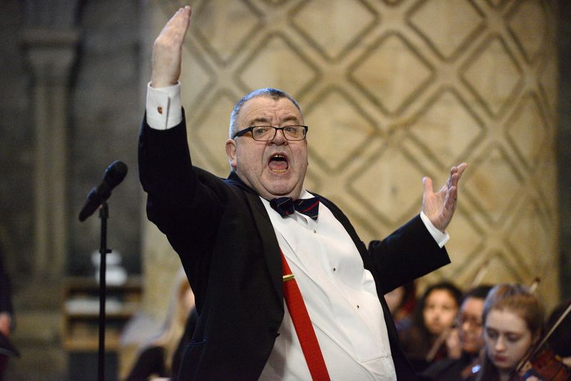 A photograph of Jeremy Dibble in Durham cathedral conducting