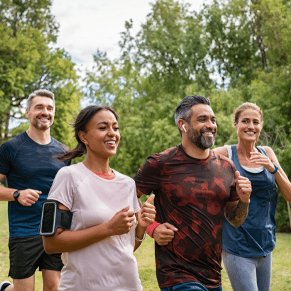 Four people running in the park