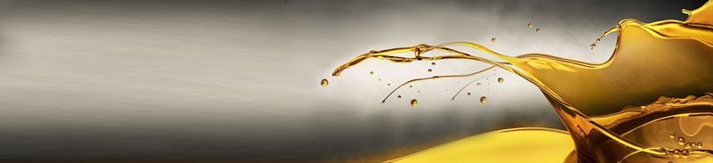 A splash of motor oil against a silver/grey background