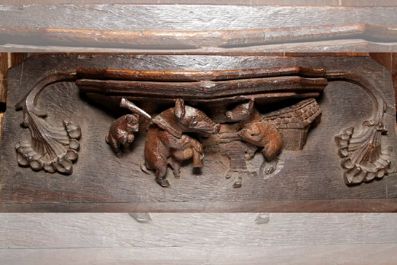 Misericord or mercy seat from the Tunstall Chapel featuring a pig playing the Northumbrian pipes.