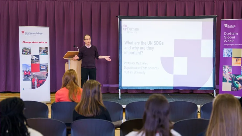 Professor Mark Allen speaking to an audience at the Global Goals Summit