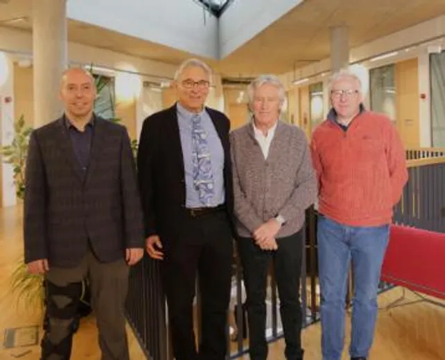 A group of people smiling at the camera