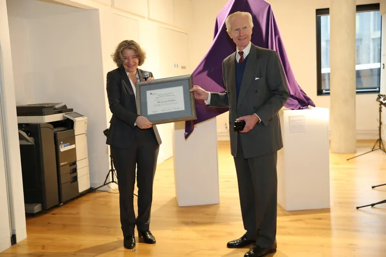 Professor Karen O’Brien, Vice-Chancellor and Warden, presenting Damon de Laszlo with the Chancellor’s Circle Certificate of Induction