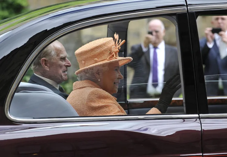 The Queen and Prince Philip in a car visiting Durham in 2012