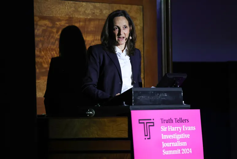 Woman speaking at lectern