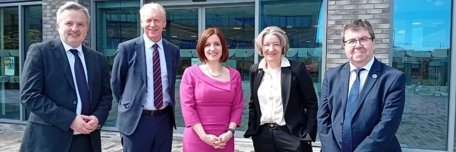 A group of people outside Durham University's Teaching and Learning Centre including Bridget Phillipson MP (centre)