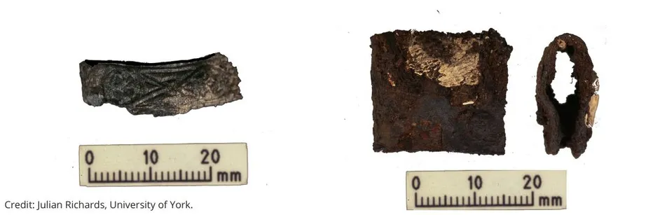 Remains of a Viking sword hilt and shield clasp