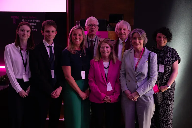 People standing smiling at camera