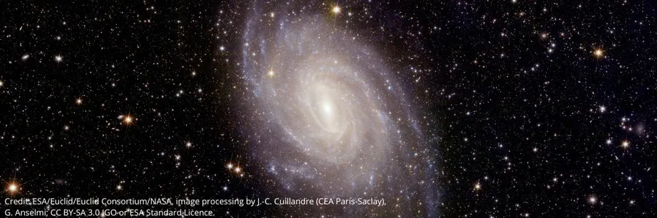 A spiral galaxy against a starry space backdrop