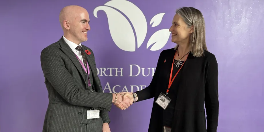 North Durham Academy Headteacher Mark Gray shaking hands with Chancellor Dr Fiona Hill
