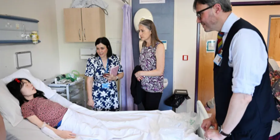 Chancellor Dr Fiona Hill with a life-like model of a patient in the Simulation Unit