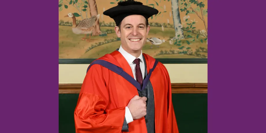 Matt Baker wearing his academic gown