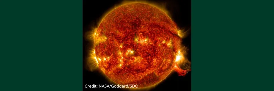 A close up image of the Sun which is orange against a black background. There are bright flares escaping from the Sun's surface.