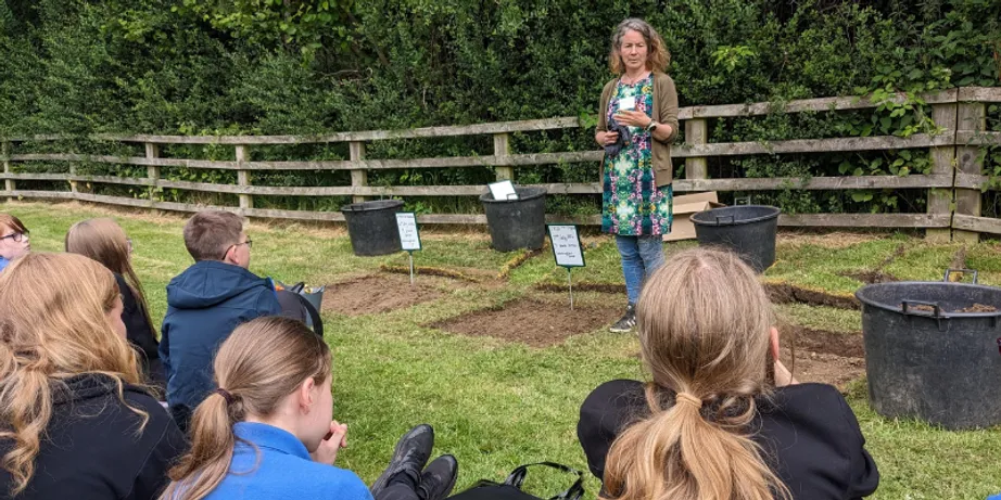 Professor Karen Johnson talks to pupils about soil health in our Botanic Garden