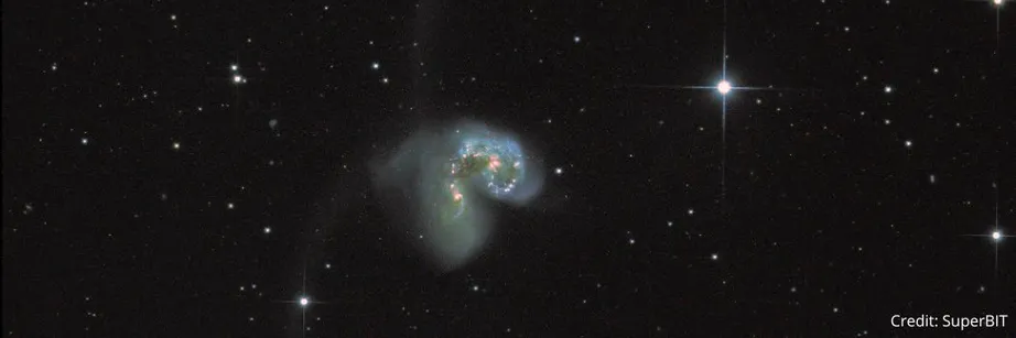 Two galaxies collide in space