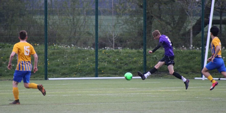 A football player kicking a ball
