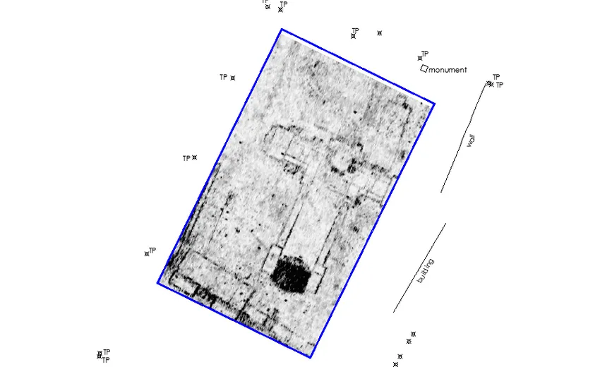 a greyscale map of gpr data showing buried archaeological features, including a former church and buildings along a street front