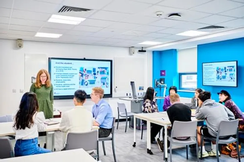 Students and tutor in a classroom