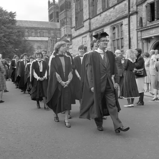 John Dewdney leads a procession towards its Graduation Congregation in the 1970s