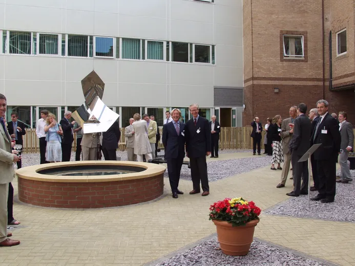 Gathering of people for the sculpture unveiling