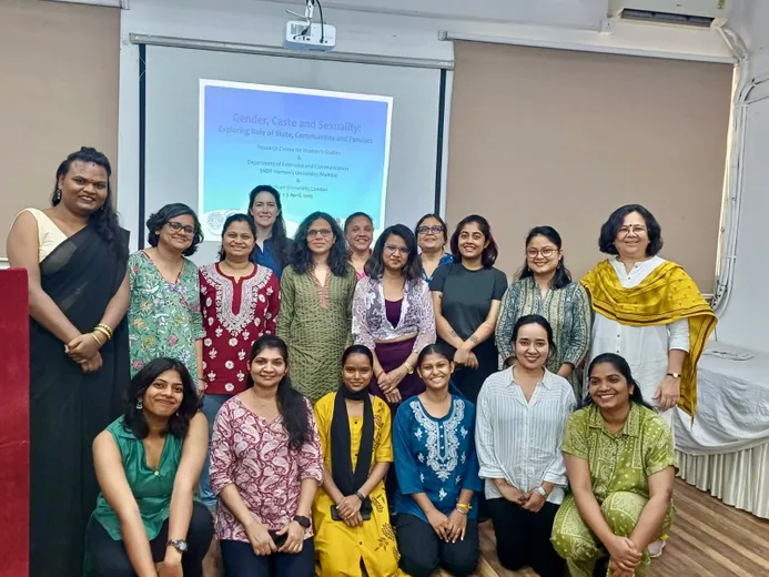 Colleagues together in a group facing the camera