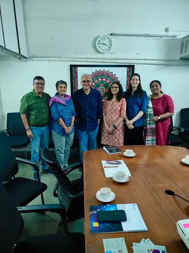 Colleagues facing the camera in a group photo