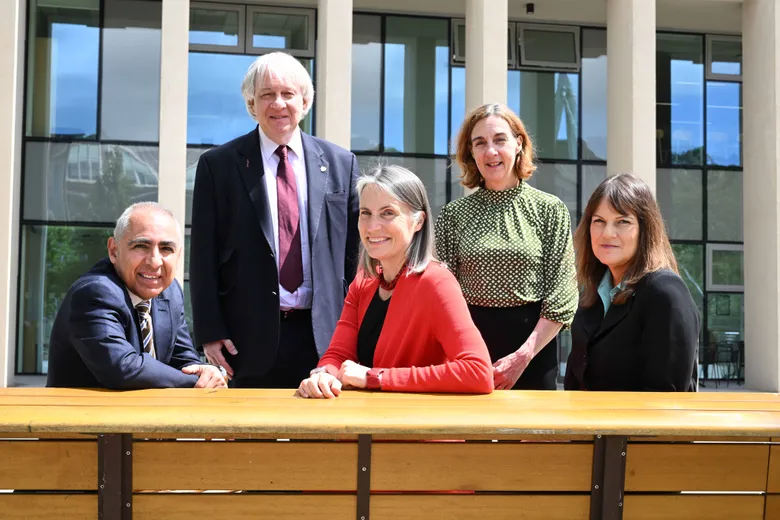 A group including Dr Fiona Hill outside the Waterside building at the Chancellor in Conversation event
