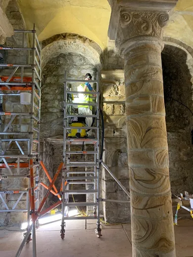 Surveying the stonework of the pillars in the Norman Chapel