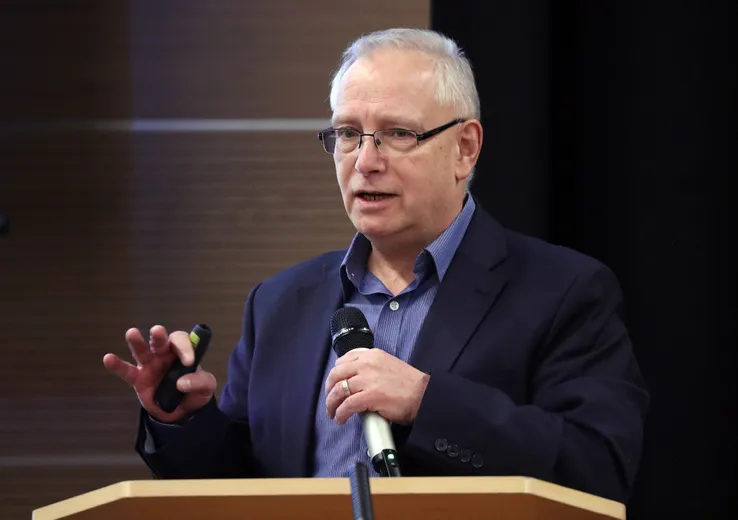 Man speaking in front of people